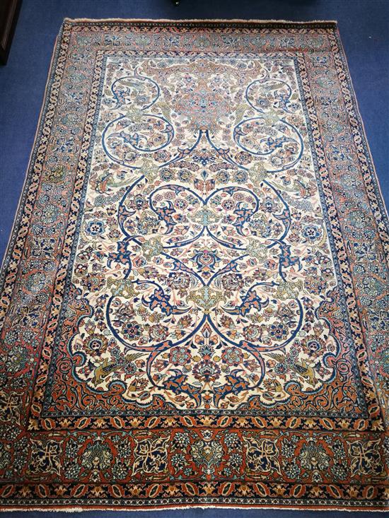 A Kashan cream-ground rug 220 x 150cn